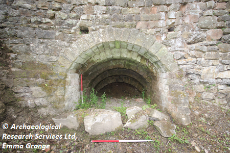 Photograph depicting the interior of the lime kiln facing south west with 2 x 1 m scales, taken during historical building recording at Plot 3, Jetting Street, Ashover, Derbyshire. Copyright: Archaeological Research Services Ltd, Emma Grange